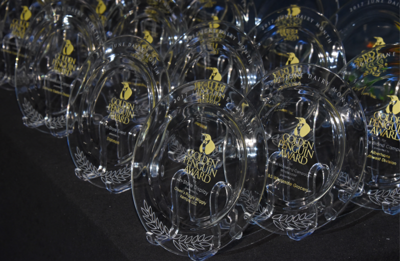 clear awards plates sitting on black table