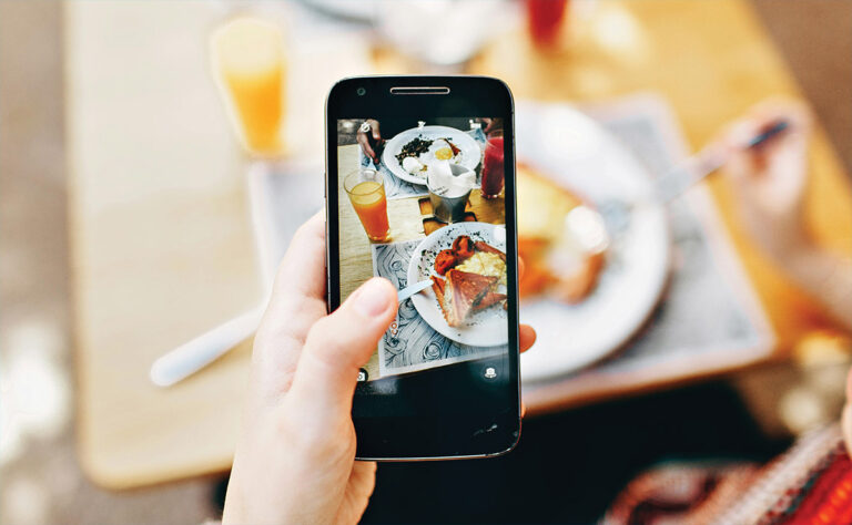 Phone taking a picture of meal